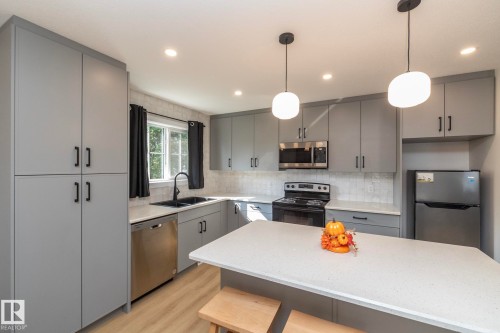 56 Brazeau Drive, Devon, AB - Indoor Photo Showing Kitchen With Double Sink With Upgraded Kitchen