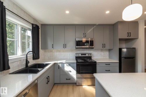 56 Brazeau Drive, Devon, AB - Indoor Photo Showing Kitchen With Double Sink