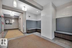 Community lobby featuring recessed lighting and tile walls - 