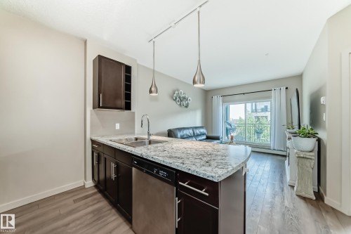 327 508 Griesbach Parade, Edmonton, AB - Indoor Photo Showing Kitchen With Double Sink