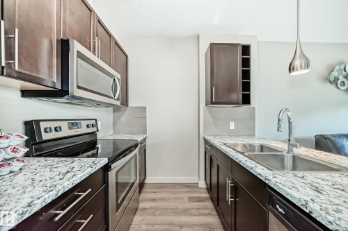 327 508 Griesbach Parade, Edmonton, AB - Indoor Photo Showing Kitchen With Double Sink With Upgraded Kitchen