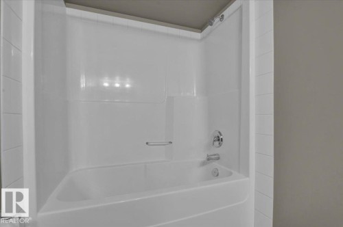 Full bath featuring bathing tub / shower combination - 226 13111 140 Avenue, Edmonton, AB - Indoor Photo Showing Bathroom