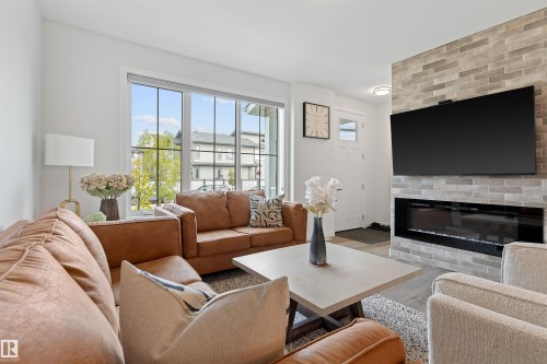 182 Caledonia Drive, Leduc, AB - Indoor Photo Showing Living Room With Fireplace