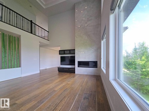 3310 Watson Bay, Edmonton, AB - Indoor Photo Showing Other Room With Fireplace