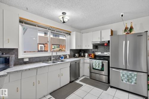 5741 144 Avenue, Edmonton, AB - Indoor Photo Showing Kitchen With Stainless Steel Kitchen With Double Sink