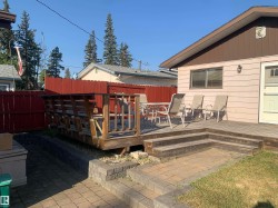 Wooden deck with a fenced backyard - 