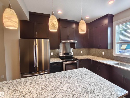 9527 75 Avenue, Edmonton, AB - Indoor Photo Showing Kitchen With Stainless Steel Kitchen With Double Sink With Upgraded Kitchen