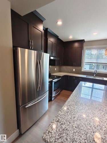 9527 75 Avenue, Edmonton, AB - Indoor Photo Showing Kitchen With Stainless Steel Kitchen With Double Sink With Upgraded Kitchen