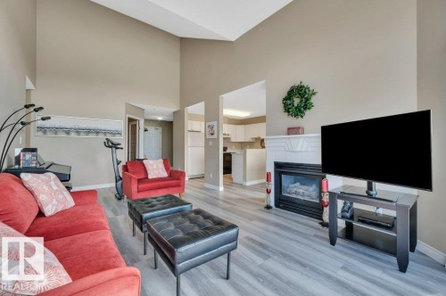 411 65 Gervais Road, St. Albert, AB - Indoor Photo Showing Living Room With Fireplace