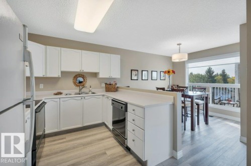 411 65 Gervais Road, St. Albert, AB - Indoor Photo Showing Kitchen With Double Sink