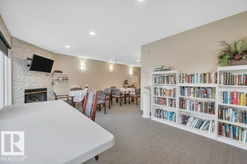 411 65 Gervais Road, St. Albert, AB - Indoor Photo Showing Other Room With Fireplace