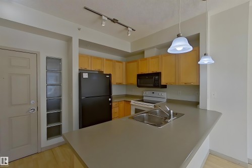 1-518 4245 139 Avenue, Edmonton, AB - Indoor Photo Showing Kitchen With Double Sink