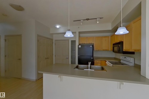 1-518 4245 139 Avenue, Edmonton, AB - Indoor Photo Showing Kitchen With Double Sink