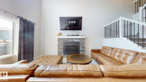 1245 26A Street, Edmonton, AB - Indoor Photo Showing Living Room With Fireplace