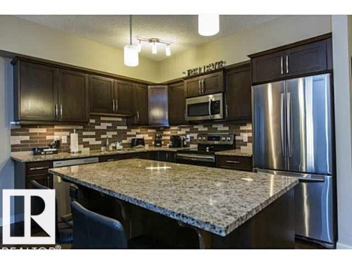 113 10530 - 56 Avenue, Edmonton, AB - Indoor Photo Showing Kitchen With Stainless Steel Kitchen With Upgraded Kitchen