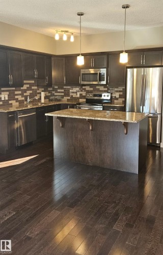 113 10530 - 56 Avenue, Edmonton, AB - Indoor Photo Showing Kitchen With Stainless Steel Kitchen With Upgraded Kitchen