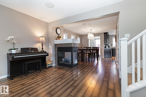 1117 Chappelle Boulevard, Edmonton, AB - Indoor Photo Showing Living Room With Fireplace