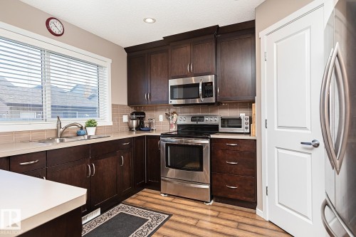 1117 Chappelle Boulevard, Edmonton, AB - Indoor Photo Showing Kitchen With Stainless Steel Kitchen With Double Sink