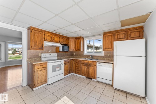 3227 145 Avenue, Edmonton, AB - Indoor Photo Showing Kitchen With Double Sink