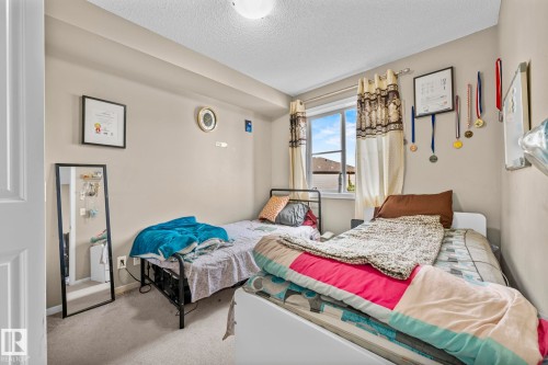 203 3207 James Mowatt Trail Sw, Edmonton, AB - Indoor Photo Showing Bedroom
