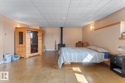 Basement with a wood stove and baseboards - 