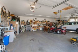 Garage with a workshop area and a garage door opener - 