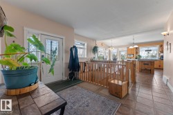 Foyer featuring baseboards and a chandelier - 
