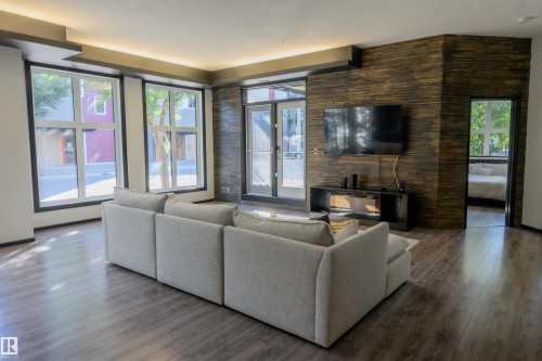 106 10531 117 Street, Edmonton, AB - Indoor Photo Showing Living Room With Fireplace
