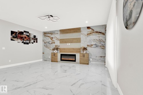 3118 Kostash Green, Edmonton, AB - Indoor Photo Showing Other Room With Fireplace