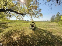 View of grassy yard with a view of countryside - 