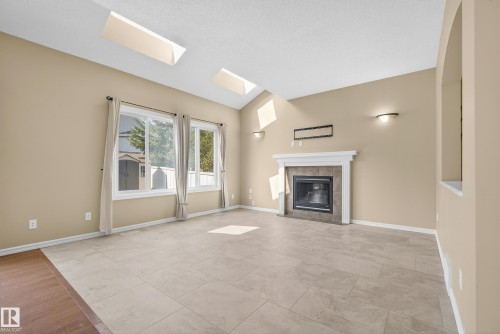 1212 82 Street, Edmonton, AB - Indoor Photo Showing Living Room With Fireplace