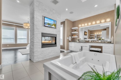 4727 Woolsey Common, Edmonton, AB - Indoor Photo Showing Other Room With Fireplace