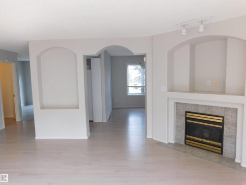 26 1295 Carter Crest Road, Edmonton, AB - Indoor Photo Showing Living Room With Fireplace