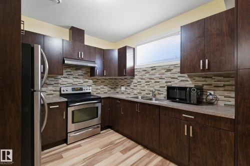 6026 164A Avenue, Edmonton, AB - Indoor Photo Showing Kitchen With Double Sink