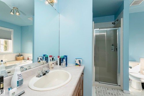Bathroom with vanity, a shower stall, and tile patterned floors - 8 Lafond Drive, Tofield, AB - Indoor Photo Showing Bathroom