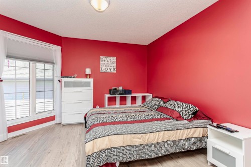Bedroom with wood finished floors and a textured ceiling - 8 Lafond Drive, Tofield, AB - Indoor Photo Showing Bedroom