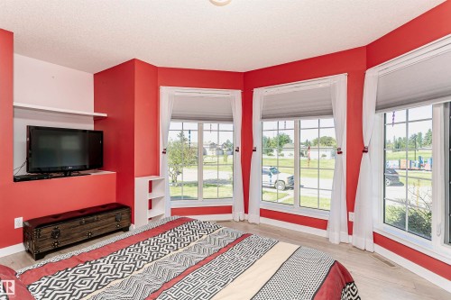 Entryway featuring a textured ceiling and wood finished floors - 8 Lafond Drive, Tofield, AB - Indoor Photo Showing Bedroom