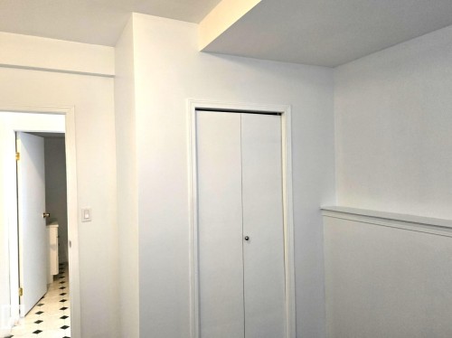 Unfurnished bedroom featuring a closet and tile patterned floors - 8 Lafond Drive, Tofield, AB - Indoor Photo Showing Other Room