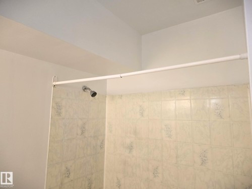 Full bathroom featuring a tile shower - 8 Lafond Drive, Tofield, AB - Indoor Photo Showing Bathroom