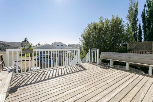 Wooden terrace featuring a residential view - 8 Lafond Drive, Tofield, AB - Outdoor With Deck Patio Veranda