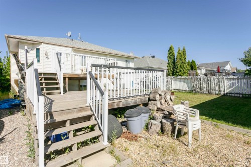 Rear view of house featuring a wooden deck and stairs - 8 Lafond Drive, Tofield, AB - Outdoor With Deck Patio Veranda