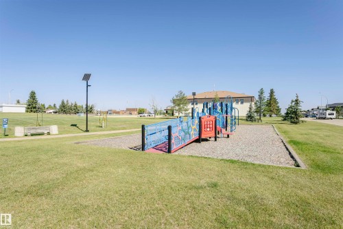 Community play area with a lawn - 8 Lafond Drive, Tofield, AB - Outdoor