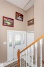 Foyer entrance featuring light tile patterned flooring and stairway - 8 Lafond Drive, Tofield, AB  - Indoor Photo Showing Other Room 
