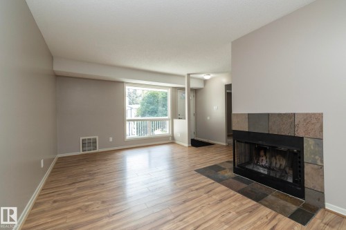 23 14620 26 Street, Edmonton, AB - Indoor Photo Showing Living Room With Fireplace