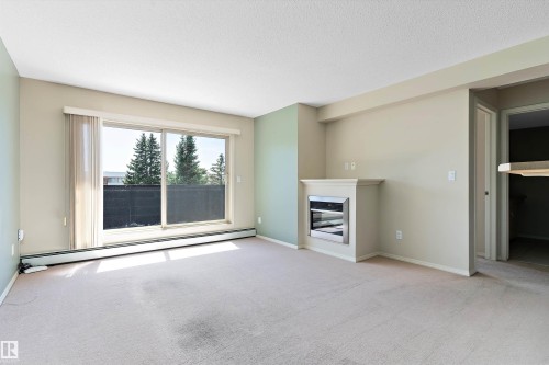 412 17011 67 Avenue, Edmonton, AB - Indoor Photo Showing Living Room With Fireplace
