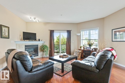 202 9905 81 Avenue, Edmonton, AB - Indoor Photo Showing Living Room With Fireplace