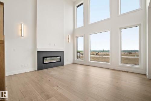 7095 Kiviaq Crescent, Edmonton, AB - Indoor Photo Showing Living Room With Fireplace