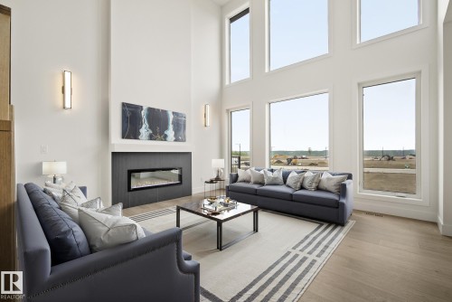 7095 Kiviaq Crescent, Edmonton, AB - Indoor Photo Showing Living Room With Fireplace