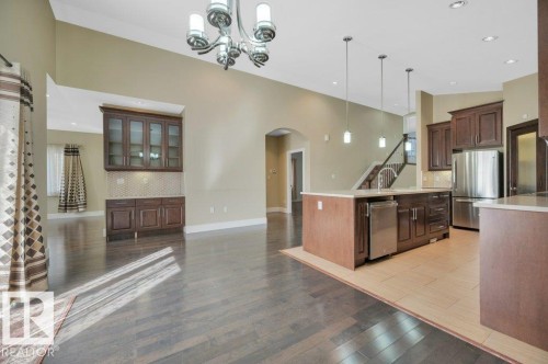 Kitchen with tasteful backsplash, arched walkways, decorative light fixtures, appliances with stainless steel finishes, and recessed lighting - 6221 167A Avenue, Edmonton, AB - Indoor Photo Showing Kitchen With Upgraded Kitchen