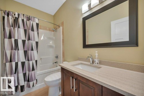 Bathroom with shower / bath combo with shower curtain and vanity - 6221 167A Avenue, Edmonton, AB - Indoor Photo Showing Bathroom